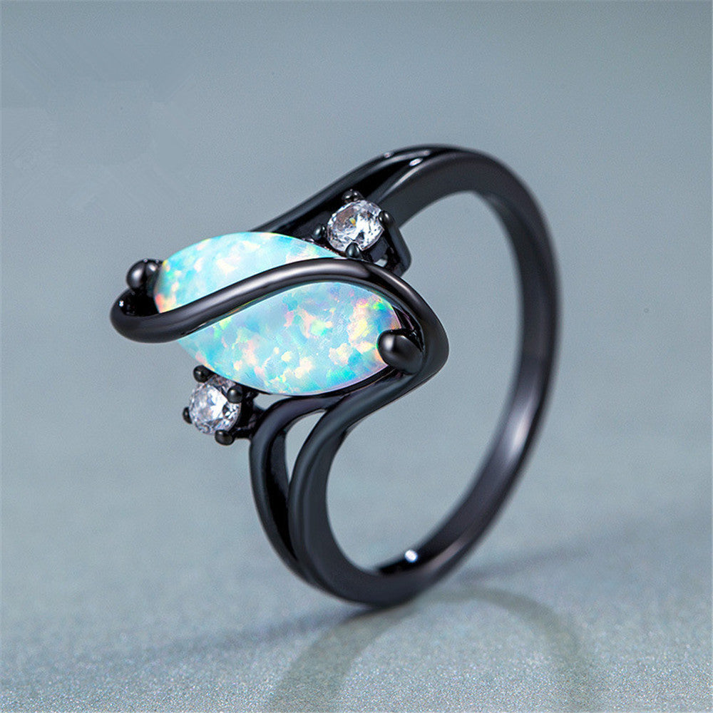 S-shaped  blue black gold horse eye ring